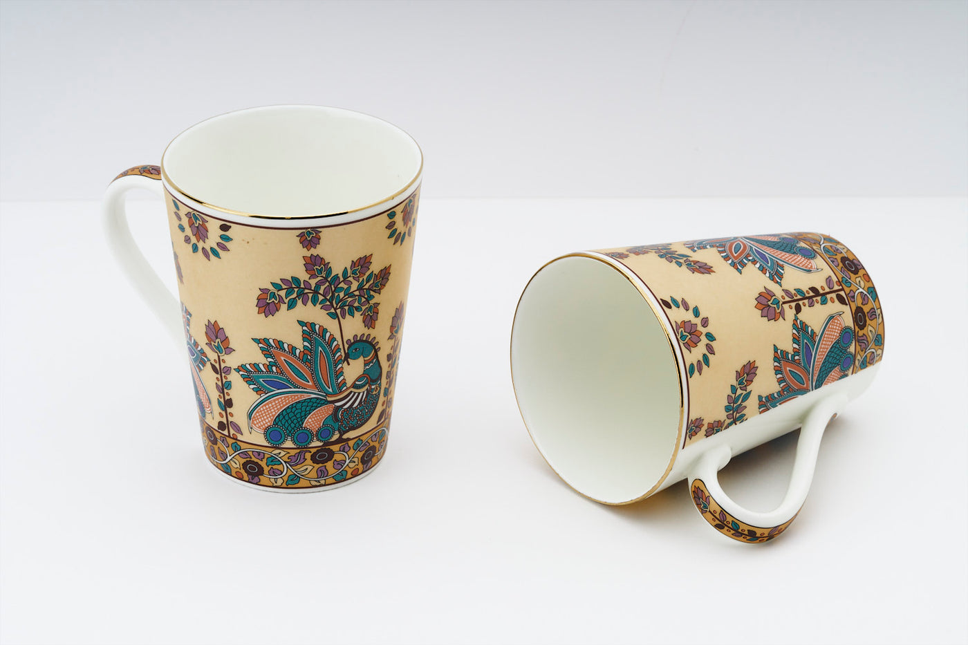 Madhubani Peacock tapered mug – Set of 2